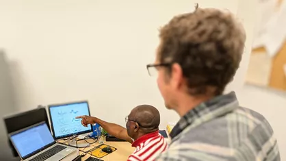 EPIC scientists in front of laptop screens